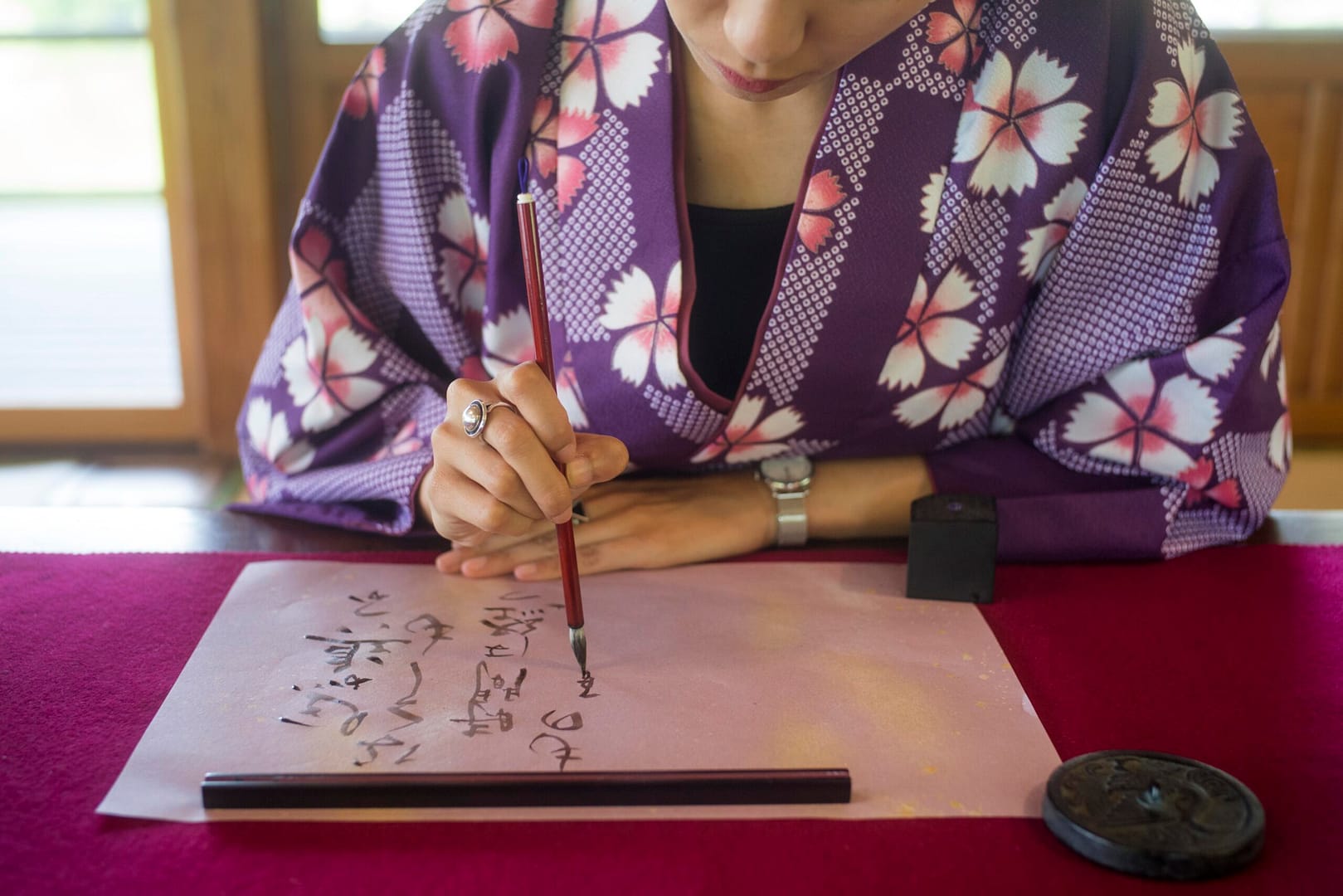 woman writing with ink japanese paper 1 scaled online earn money without investment(in Pakistan)